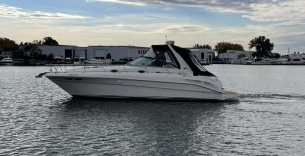 Sea Ray 340 Sundancer 2002 Sea Ray 340 Sundancer cruising on a calm waterway.