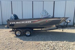 Tracker Targa V-18 WT 2017 Tracker Targa V-18 WT boat on trailer, parked on gravel.