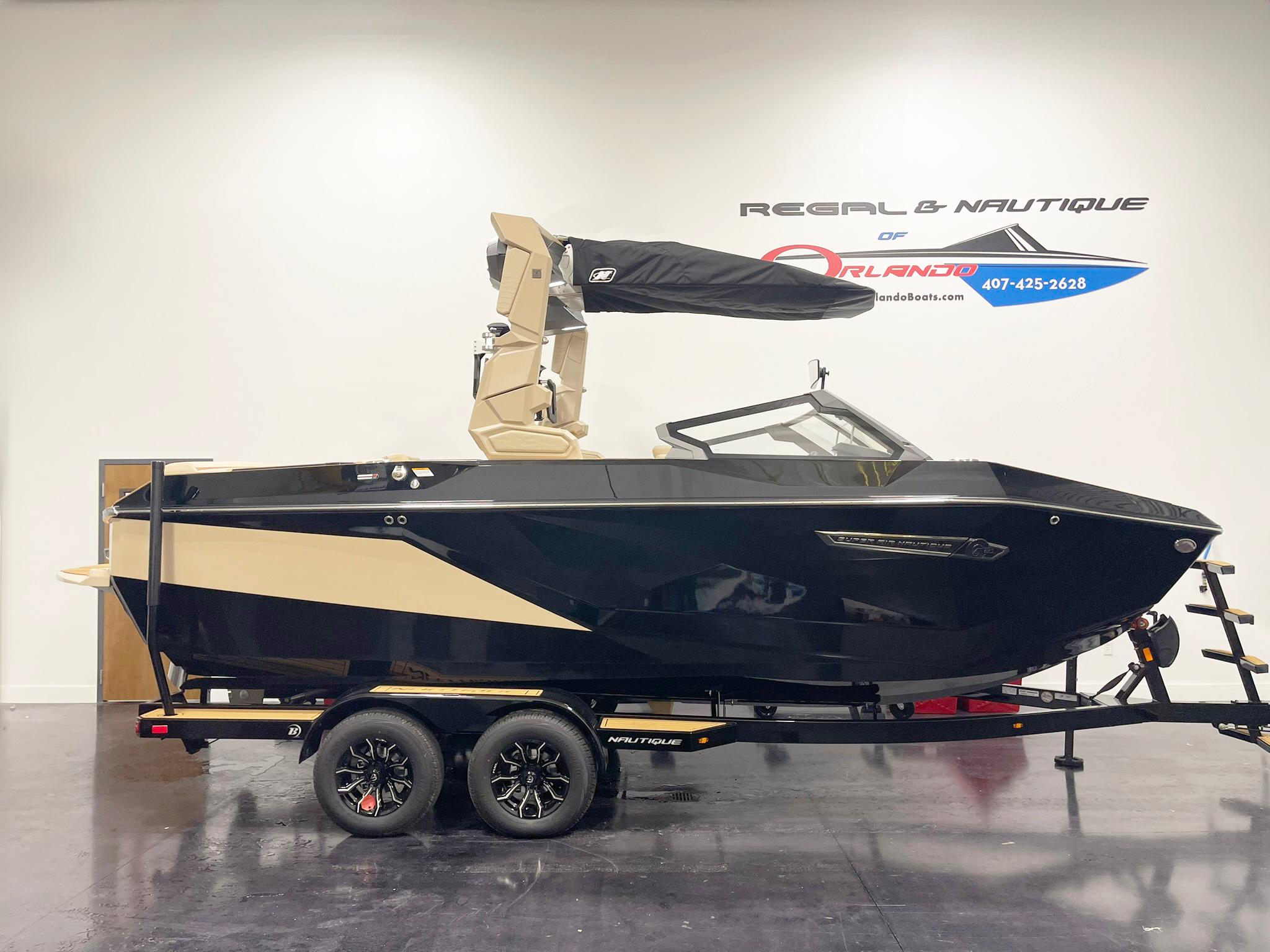 Nautique Super Air Nautique G25 2025 Nautique Super Air Nautique G25 boat on trailer in showroom.