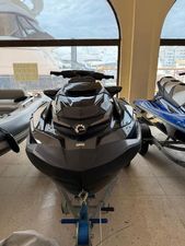 Sea-Doo GTX Limited 300 2022 Sea-Doo RXT 300 jet ski displayed indoors, front view.