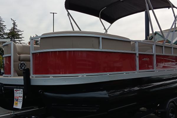 Ranger Reata 200C 2024 Ranger Reata 200C pontoon boat with red and beige design, parked outdoors.