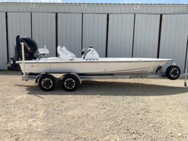 Blazer 675 Ultimate Bay 2025 Blazer 675 Ultimate Bay boat on trailer, parked outdoors.