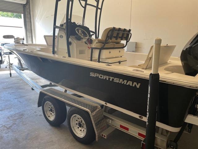 Sportsman 227 Platinum 2017 Sportsman 227 Platinum boat on trailer in garage setting.
