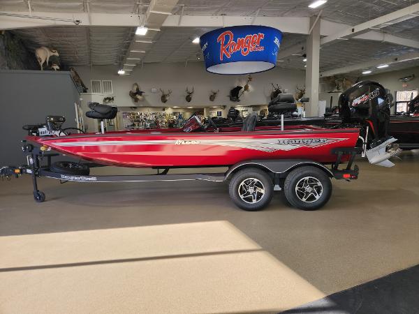Ranger RT198P 2025 Ranger RT198P red boat displayed indoors on a trailer.