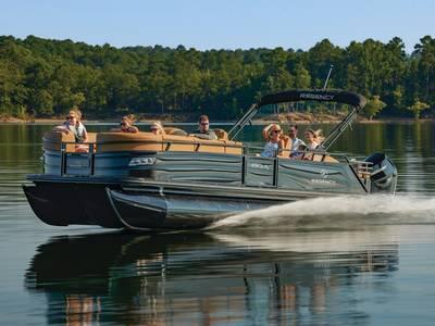 Regency 250 LE3 Sport 2025 Regency 250 LE3 Sport pontoon boat cruising on a serene lake with passengers.