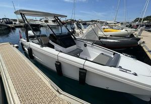 Axopar 22 2021 Axopar 22 boat docked at marina, featuring sleek design and modern amenities.