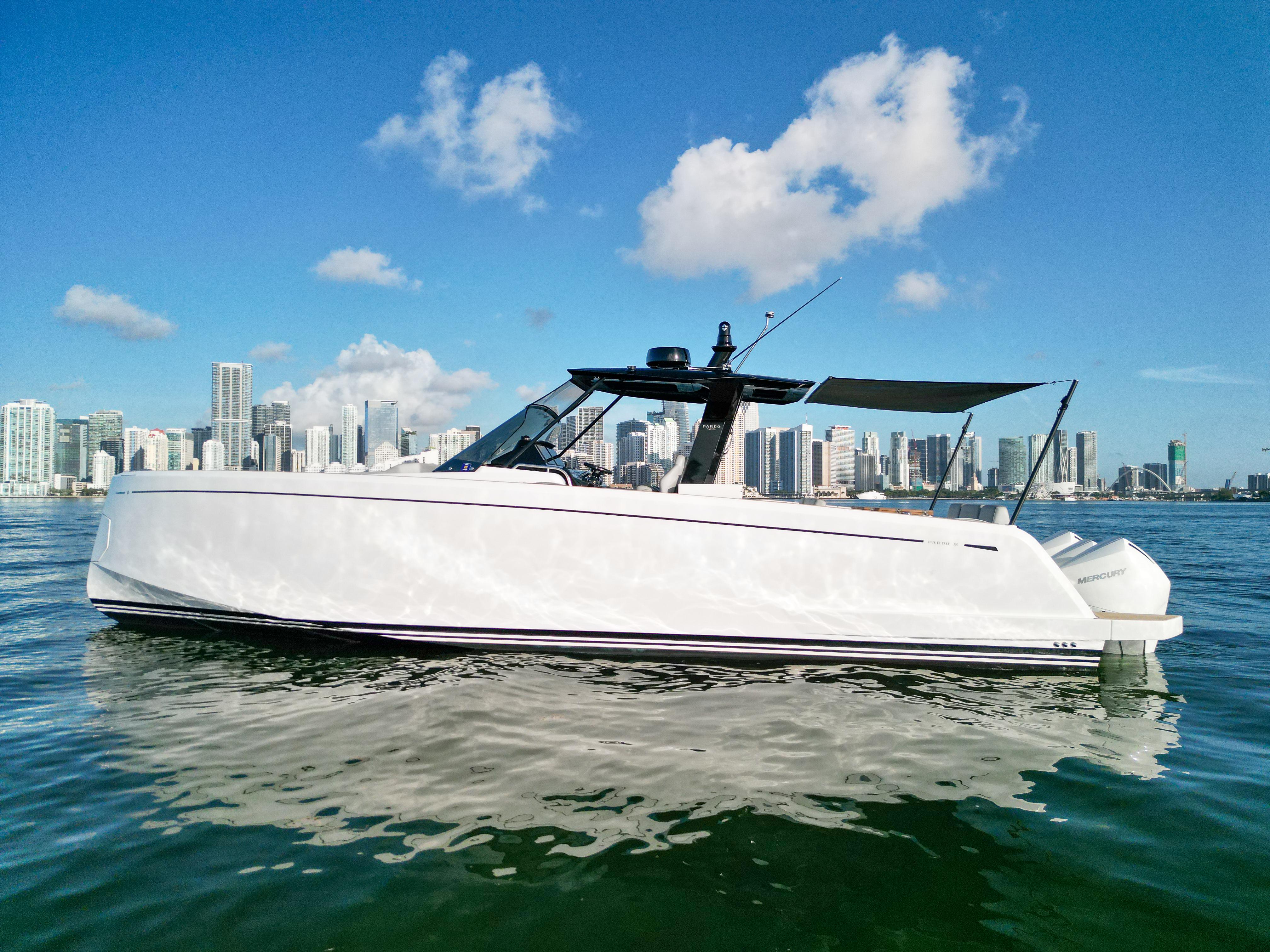 Pardo Yachts 38 2022 Pardo Yachts 38 cruising on water with city skyline backdrop.