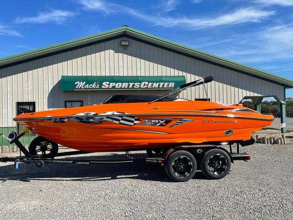 Crownline 220 SS LPX 2023 Crownline 220 SS LPX boat in vibrant orange at Mack's Sports Center.