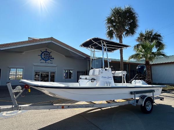 Shallow Stalker Cat 204 2025 Shallow Stalker Cat 204 boat on trailer, parked outside a marine store.