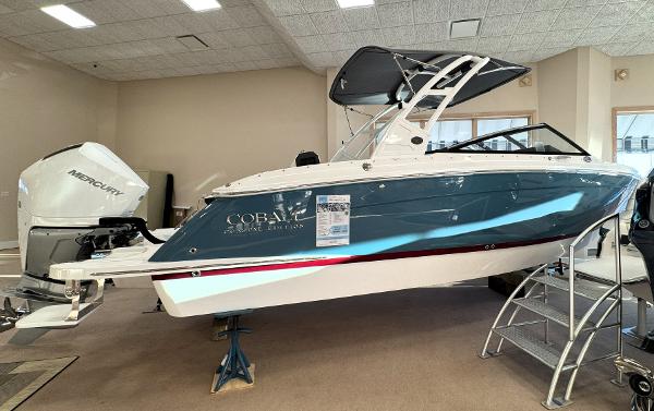 Cobalt R6 Outboard 2025 Cobalt R6 Outboard boat displayed indoors with Mercury engine.