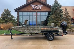 Tracker Grizzly 1756 T Marsh 2026 Tracker Grizzly 1756 T Marsh boat displayed outside Tracker Boats showroom.