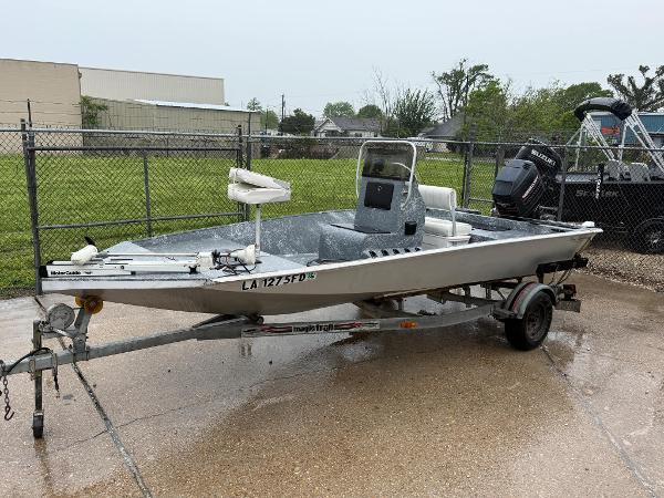 Custom Team Persuasion 18 Custom Team Persuasion 18 boat, 2000 model, on trailer in fenced area.