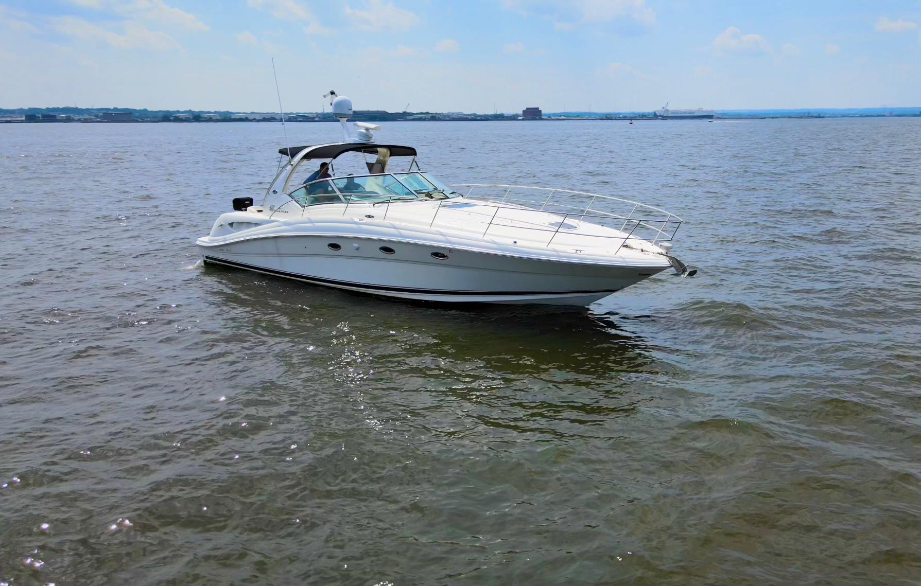 Sea Ray 420 Sundancer 2003 Sea Ray 420 Sundancer yacht cruising on open water under a clear sky.