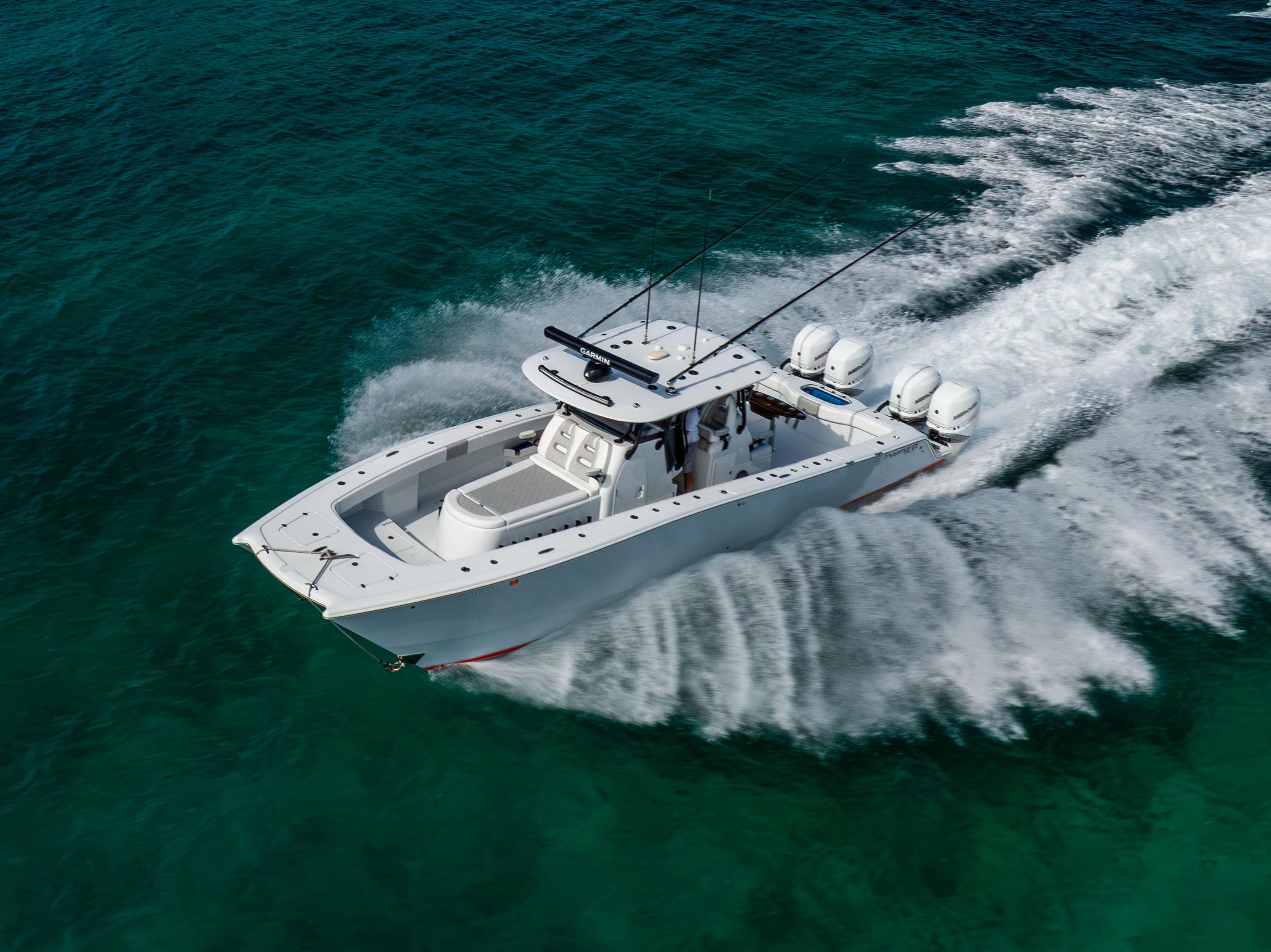 Freeman 37 VH Freeman 37 VH 2022 boat cruising on clear turquoise water, aerial view.