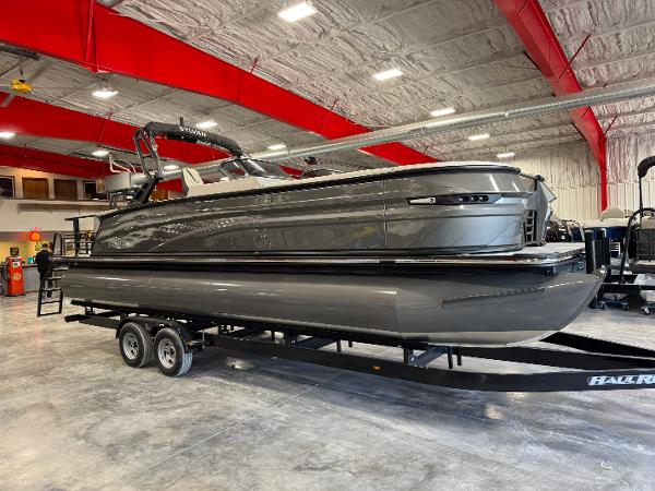 Sylvan G5 DLZ DC 2025 Sylvan G5 DLZ DC pontoon boat on trailer in showroom.