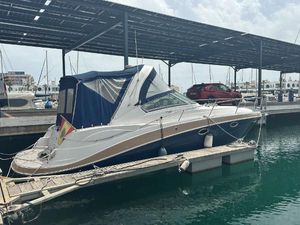 Four Winns 318 Vista 2009 Four Winns 318 Vista boat docked at marina under canopy.