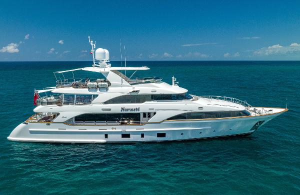Benetti Classic Luxurious 2013 Benetti Classic yacht on open sea under clear blue sky.