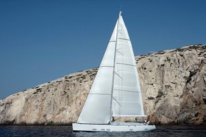 Nautor Swan Swan 82 Swan 82 sailboat from 2008 by Nautor Swan, sailing near rocky coastline.