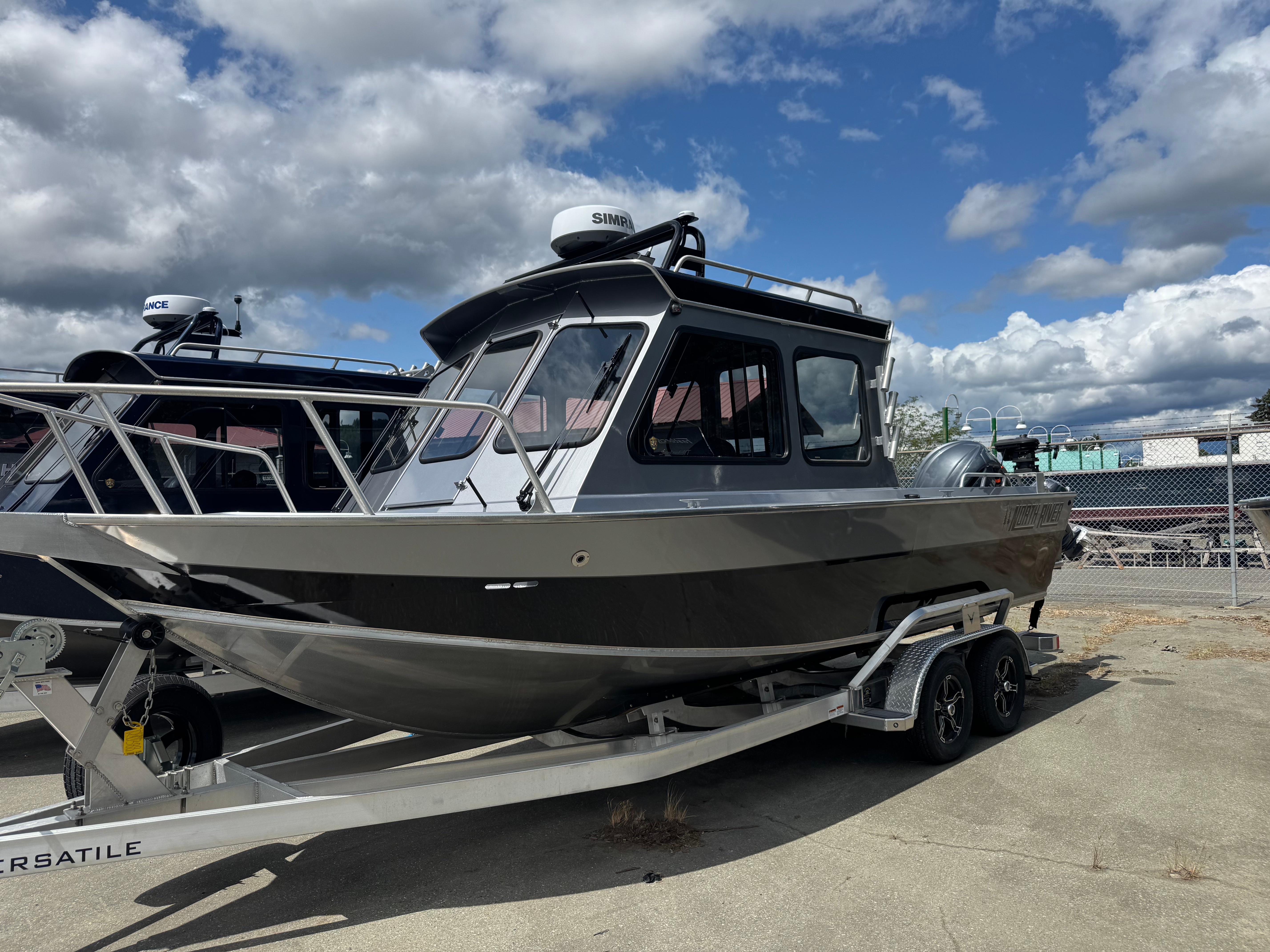 North River Seahawk 2024 North River Seahawk boat on trailer under cloudy sky.