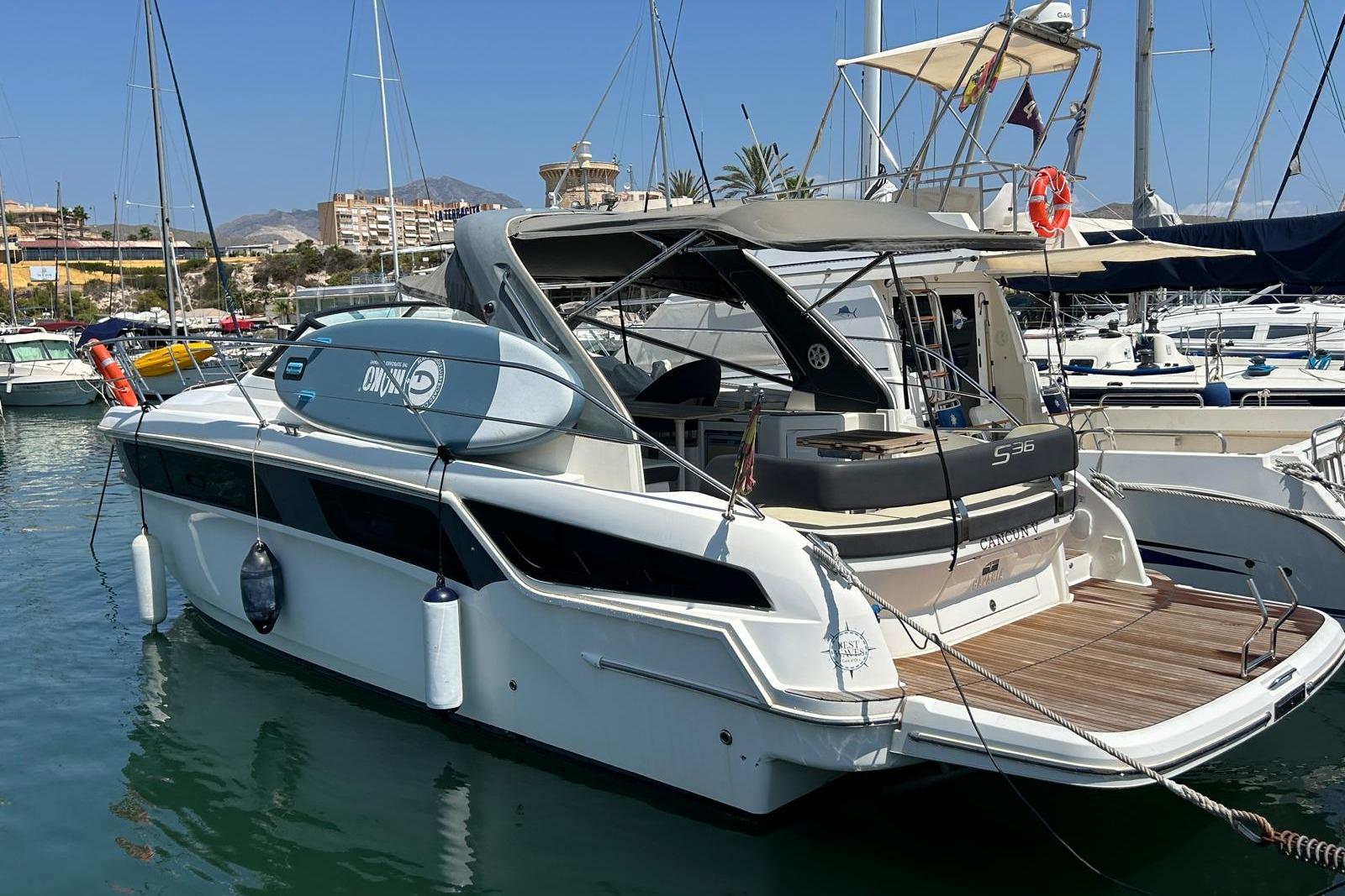 Bavaria S36 Open 2020 Bavaria S36 Open yacht docked in a marina, featuring sleek design and modern amenities.