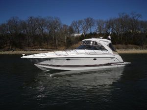 Formula 40 Performance Cruiser 2017 Formula 40 Performance Cruiser on calm water, with trees in the background.