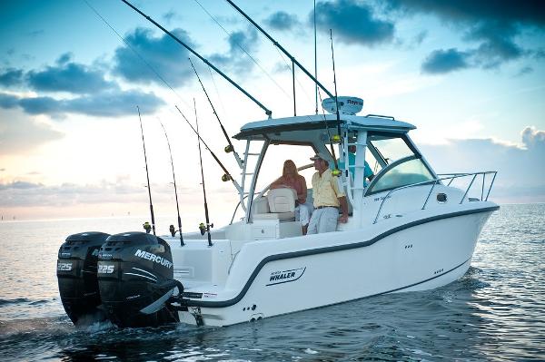 Boston Whaler 285 Conquest Manufacturer Provided Image: 2019 Boston Whaler 285 Conquest boat on water at sunset.