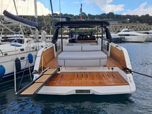 Cranchi A 46 2024 Cranchi A 46 yacht with spacious deck and luxurious seating in marina.