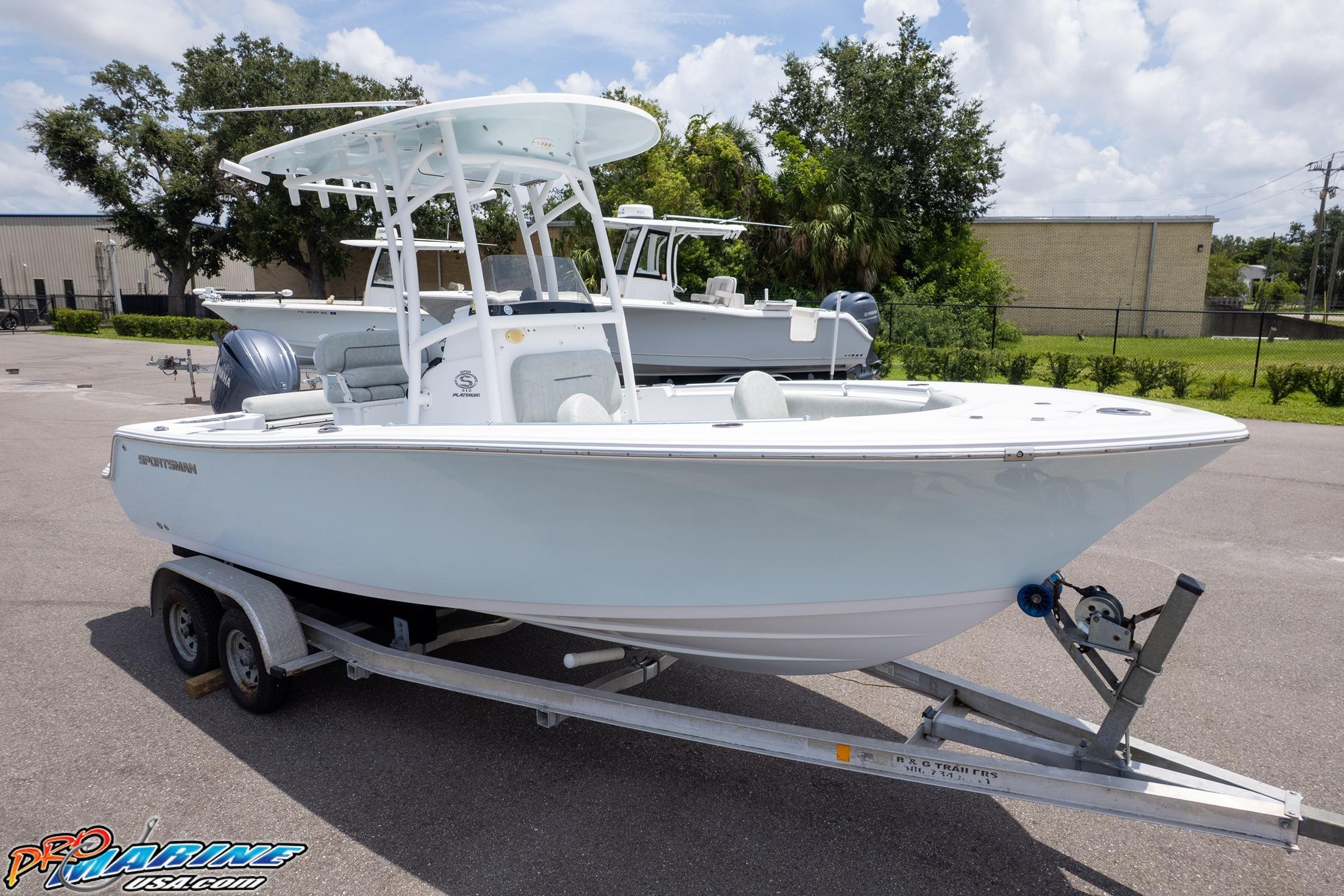 Sportsman Open 212 Center Console 2019 Sportsman Open 212 Center Console boat on trailer, parked outdoors.