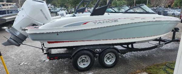 Tahoe 210 S 2024 Tahoe 210 S boat on a trailer with a Mercury outboard motor.