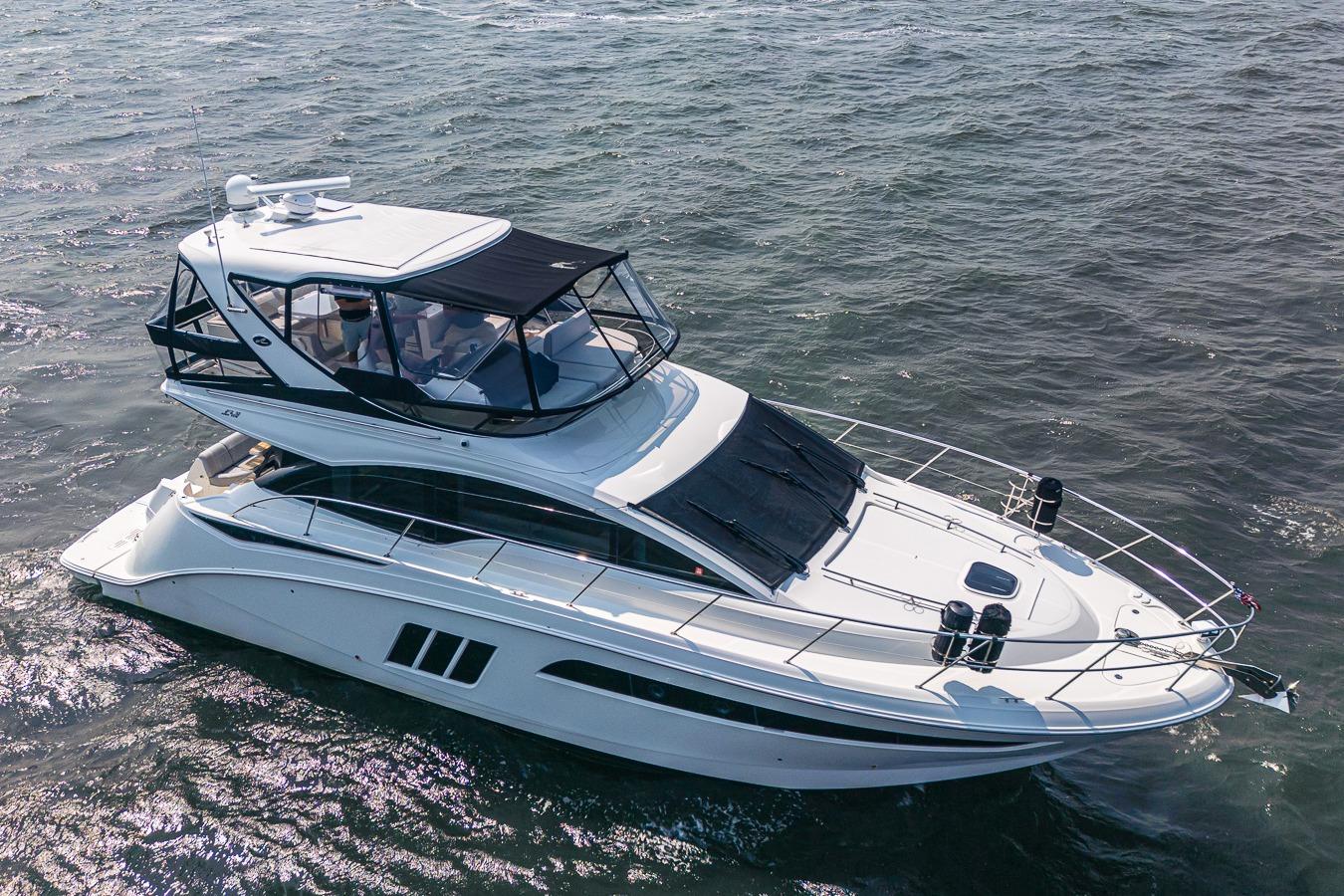 Sea Ray Fly 510 2017 Sea Ray Fly 510 yacht cruising on open water, aerial view.