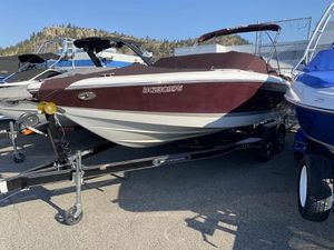 Cobalt 220 2008 Cobalt 220 boat on trailer, maroon and white, parked outdoors.