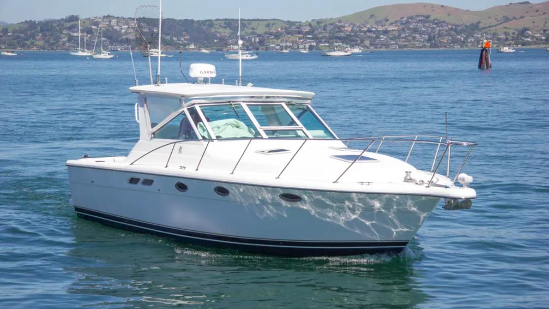 Tiara Yachts 3100 Open 2002 Tiara Yachts 3100 Open cruising on a sunny day in a scenic bay.