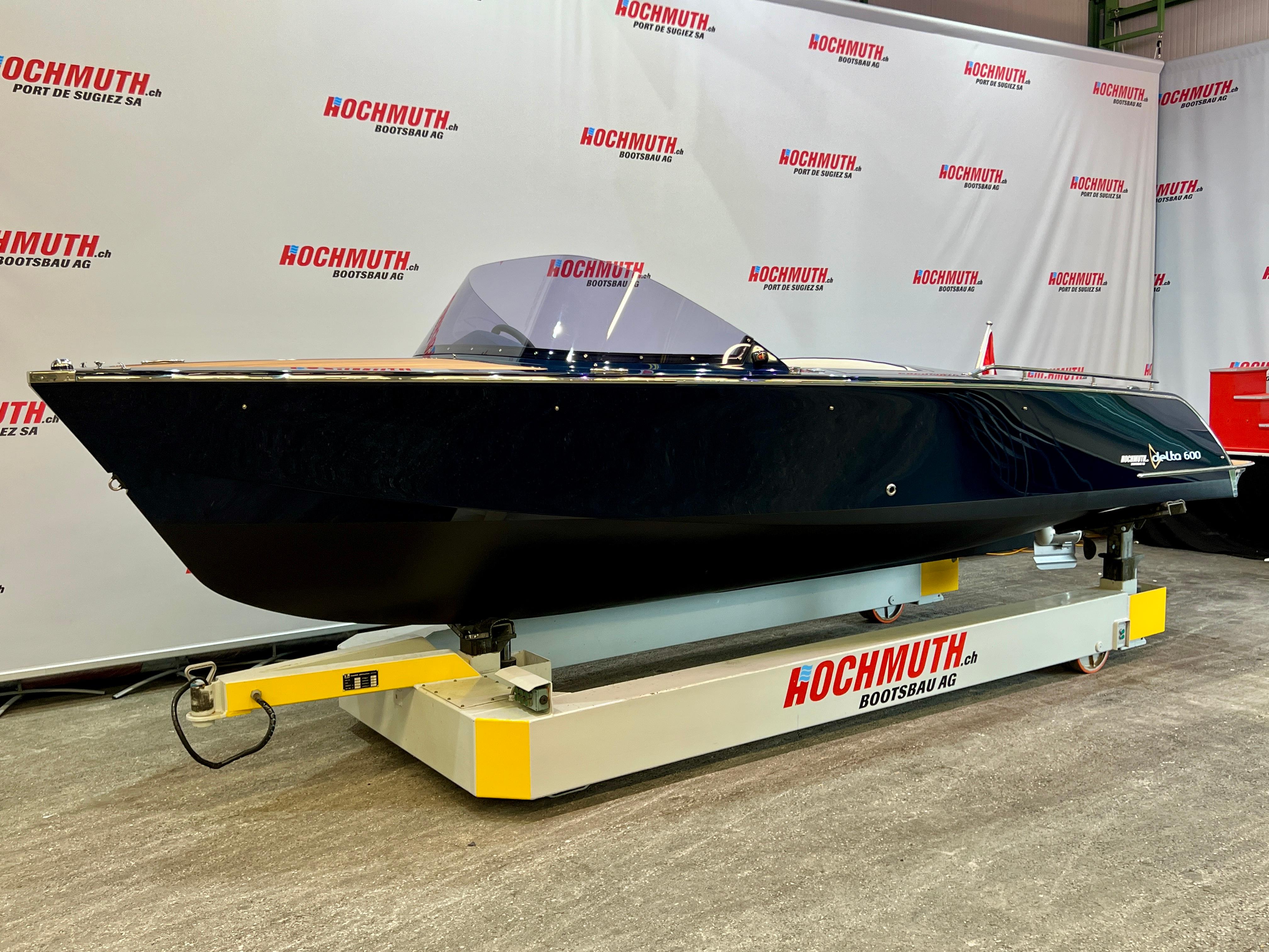 Marian Delta 600 2024 Marian Delta 600 boat displayed at Hochmuth event, sleek black design.