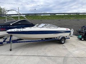 Stingray 195 FX Ski & Fish 2005 Stingray 195 FX Ski & Fish boat on trailer in a marina.
