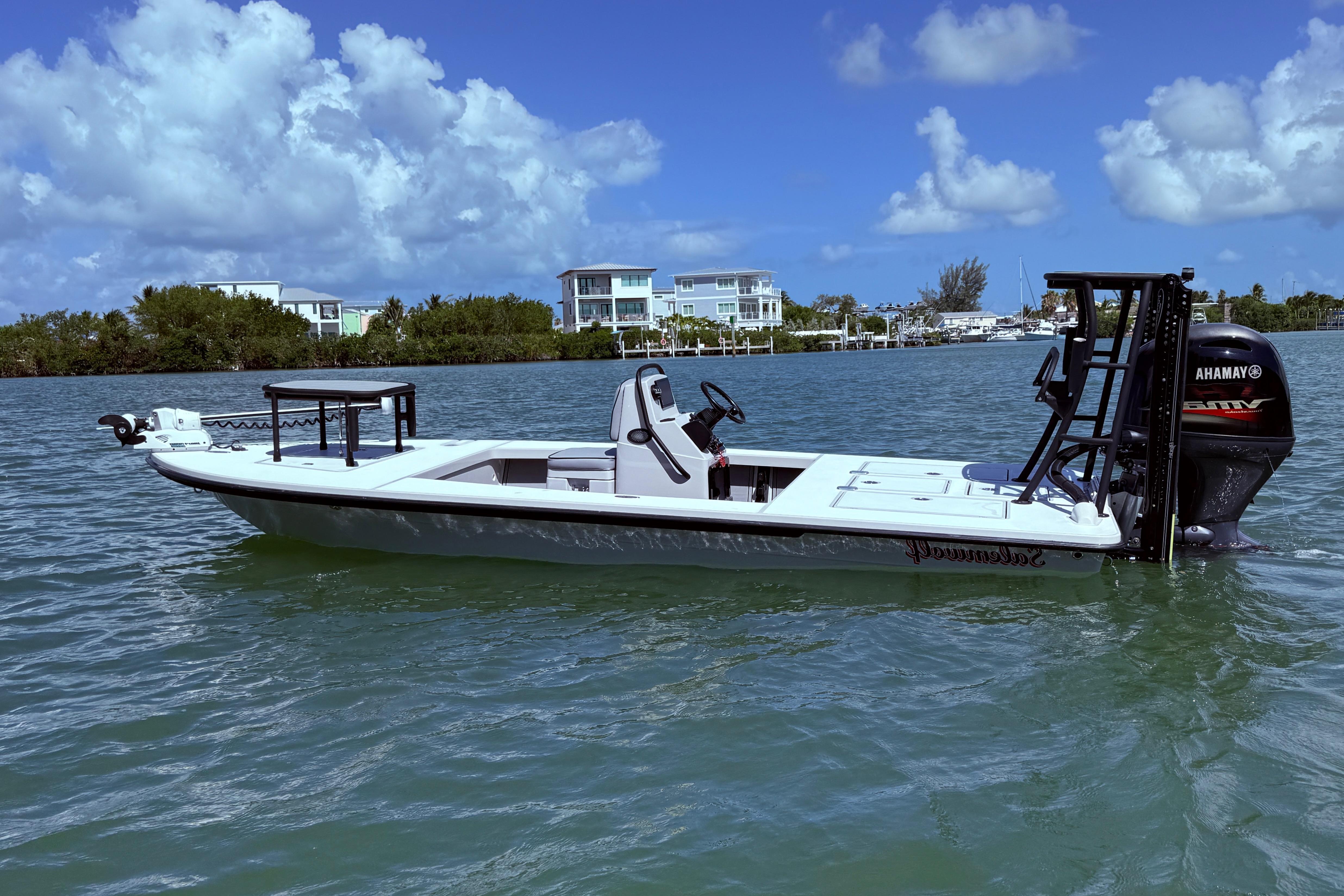 Maverick 18 HPX-V 2017 Maverick 18 HPX-V boat on water under blue sky with clouds.