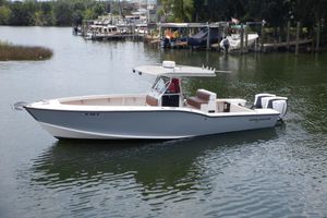 Ocean Master 31 Center Console 1995 Ocean Master 31 Center Console boat on calm water, docked near a marina.