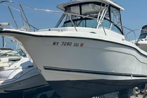 Seaswirl Striper 2601 Walkaround O/B 2001 Seaswirl Striper 2601 Walkaround O/B boat on display, featuring sleek white design.
