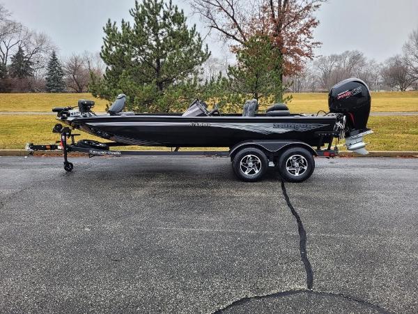 Ranger RT198P 2024 Ranger RT198P fishing boat on a trailer in a park.