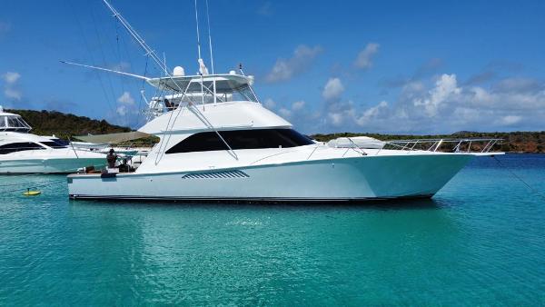 Viking 56 2004 Viking 56 yacht anchored in clear turquoise water.