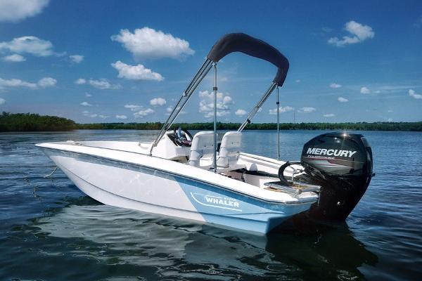 Boston Whaler 130 Super Sport Manufacturer Provided Image: 2022 Boston Whaler 130 Super Sport boat on calm water with Mercury outboard motor.
