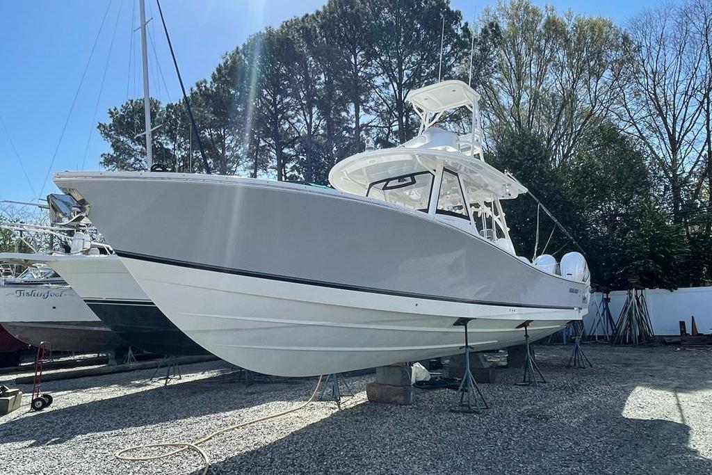 Regulator 41 2019 Regulator 41 boat on stands, surrounded by trees and other boats.