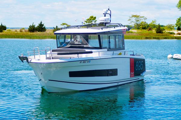 Jeanneau NC Sport 895 2023 Jeanneau NC Sport 895 boat on calm water, showcasing sleek design and modern features.