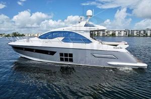 Azimut 55S 2015 Azimut 55S yacht cruising on a sunny day with blue skies.