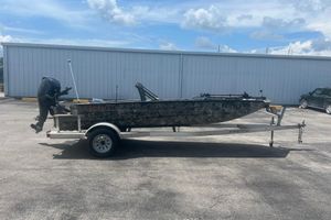Excel 1860 Viper F4 2019 Excel 1860 Viper F4 boat on trailer, parked outdoors under cloudy sky.