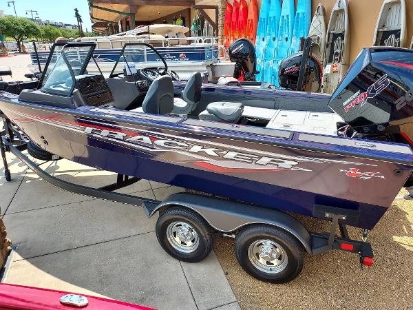 Tracker Targa V-19 WT 2023 Tracker Targa V-19 WT boat on trailer, displayed outdoors.