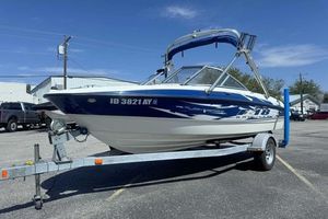 Bayliner Element F18 2008 Bayliner Element F18 boat on trailer in parking lot, clear sky background.