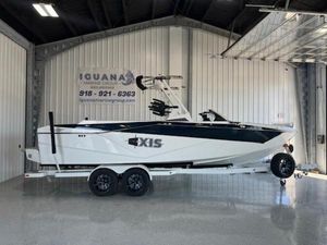 Axis T250 2024 Axis T250 boat on trailer in showroom, side view.