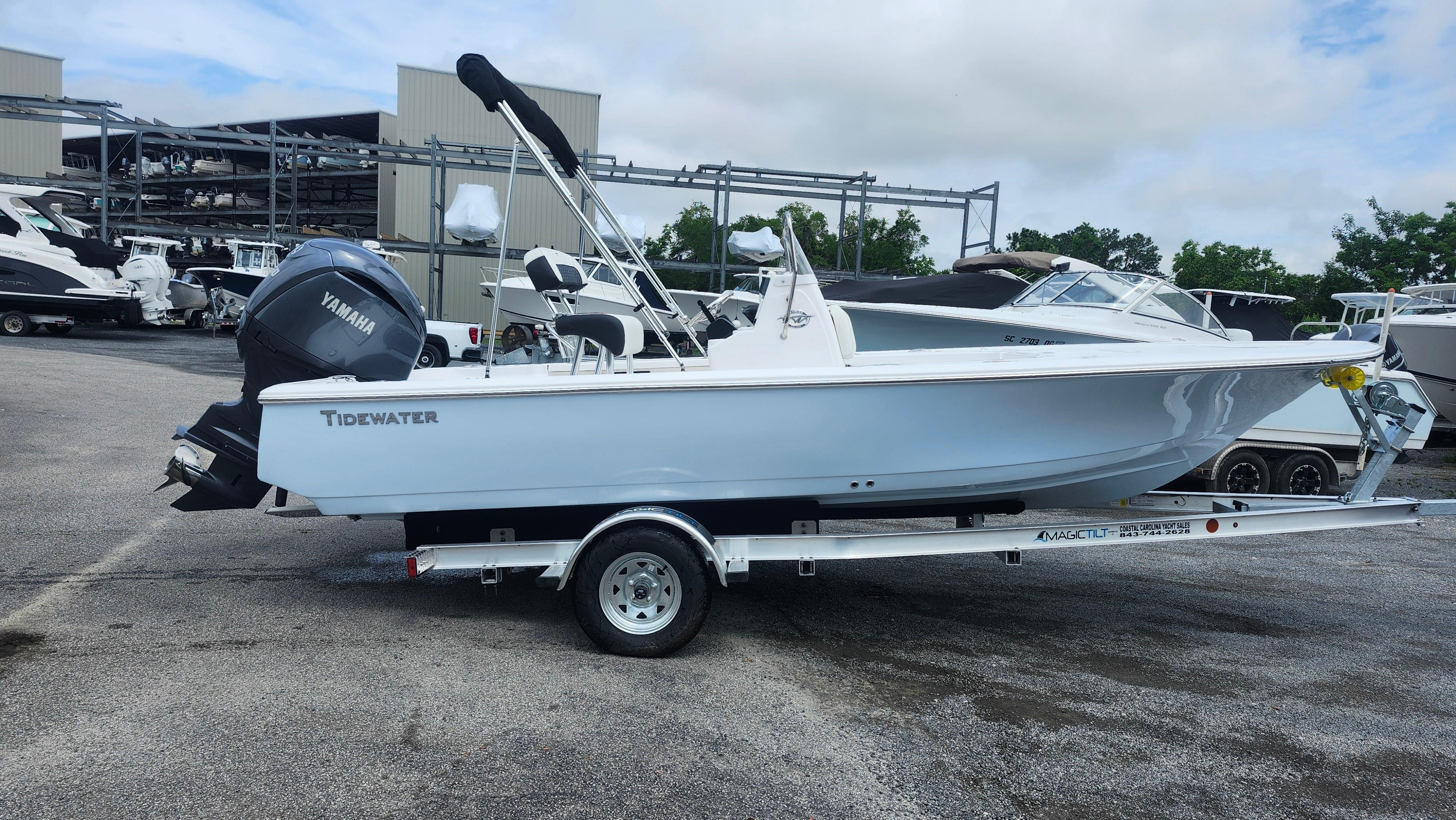 Tidewater 1910 Bay Max 2025 Tidewater 1910 Bay Max boat on trailer with Yamaha engine, parked outdoors.