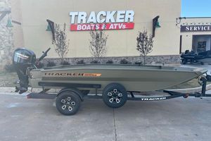 Tracker Grizzly 1756 T Marsh 2026 Tracker Grizzly 1756 T Marsh boat on trailer, displayed outside Tracker dealership.