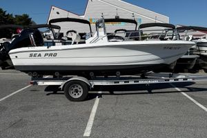Sea Pro 190 Center Console 2004 Sea Pro 190 Center Console boat on trailer in parking lot.